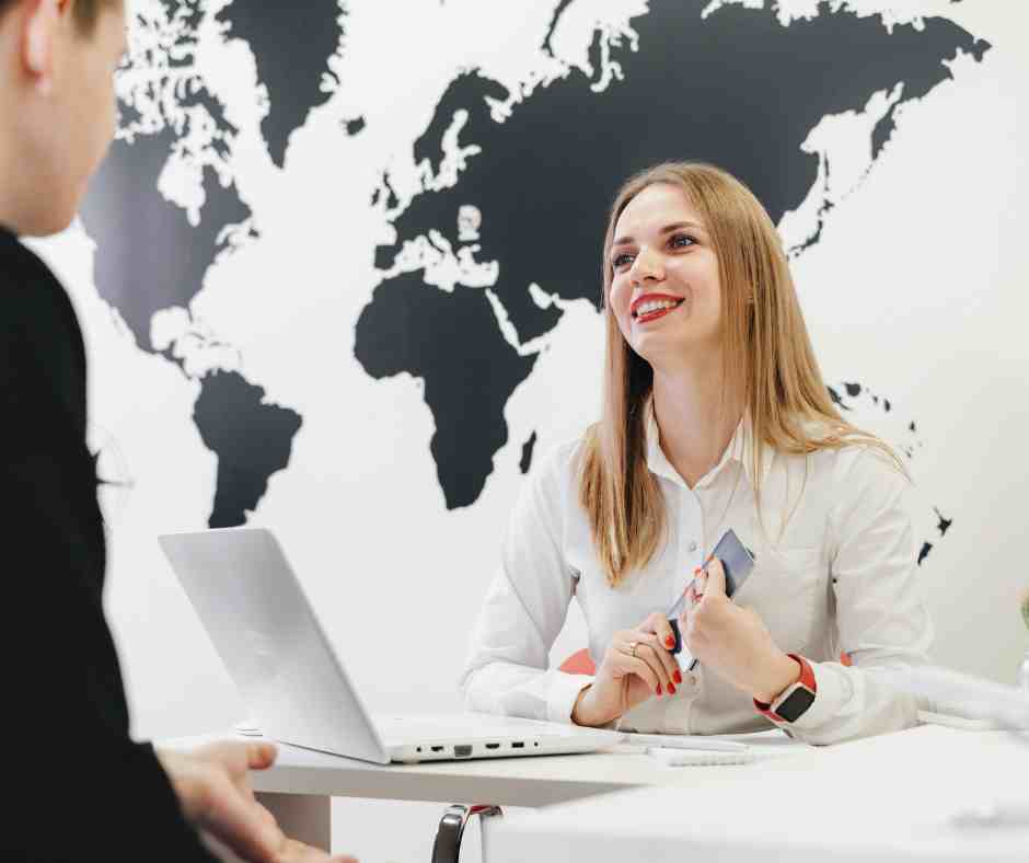 travel agent sitting behind computer